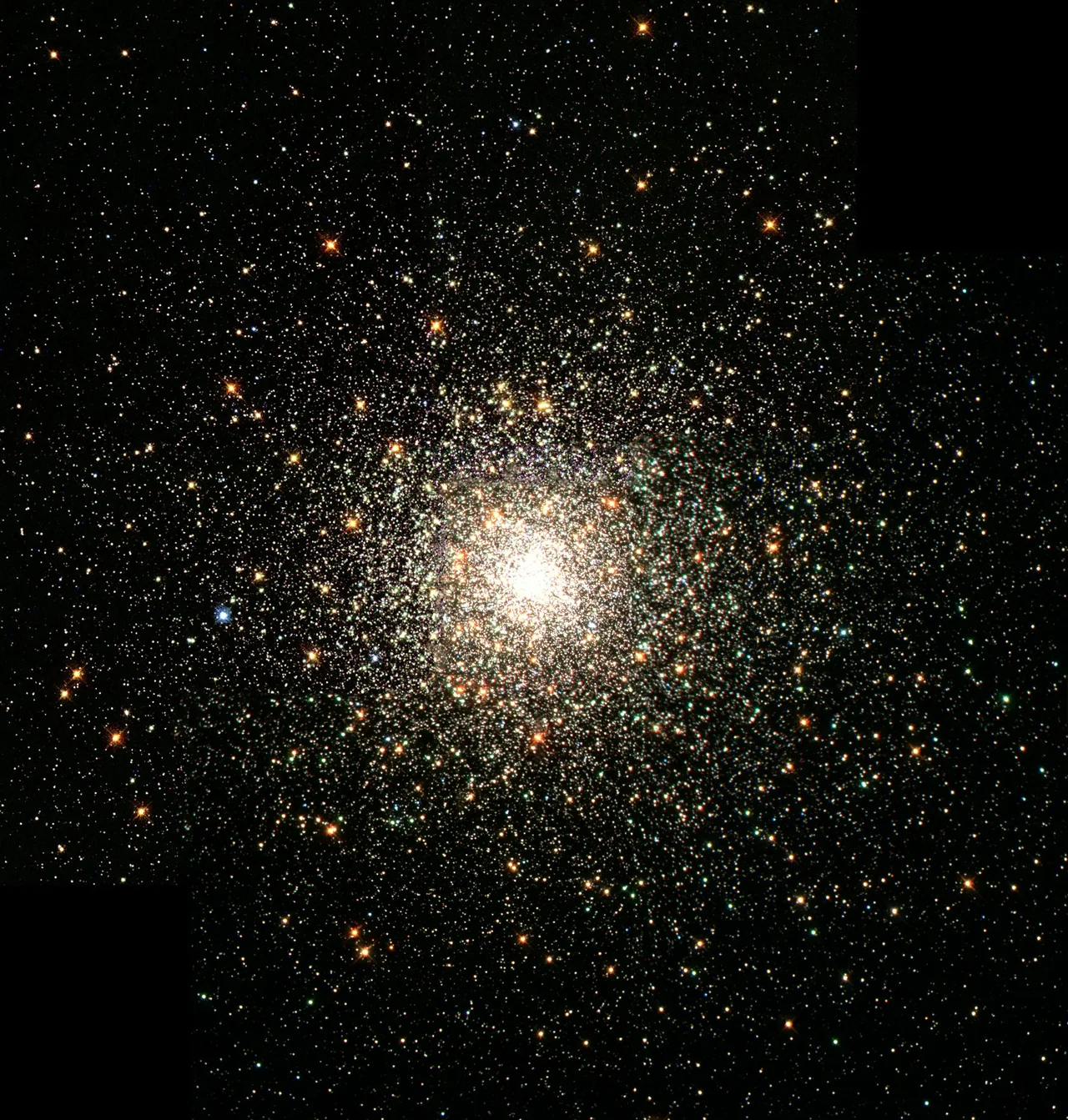 A dense cluster of stars glowing at its heart